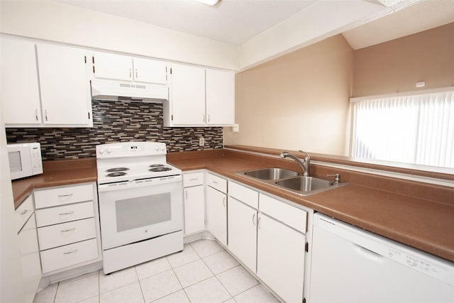 kitchen featuring decorative backsplash, white appliances, sink, white cabinets, and light tile patterned flooring