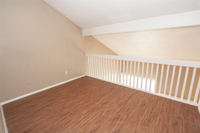 bonus room featuring wood-type flooring and vaulted ceiling