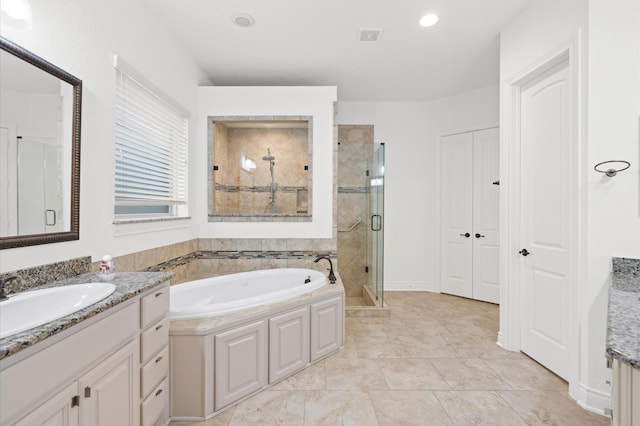 bathroom featuring vanity and separate shower and tub