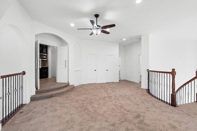 unfurnished room featuring carpet floors and ceiling fan