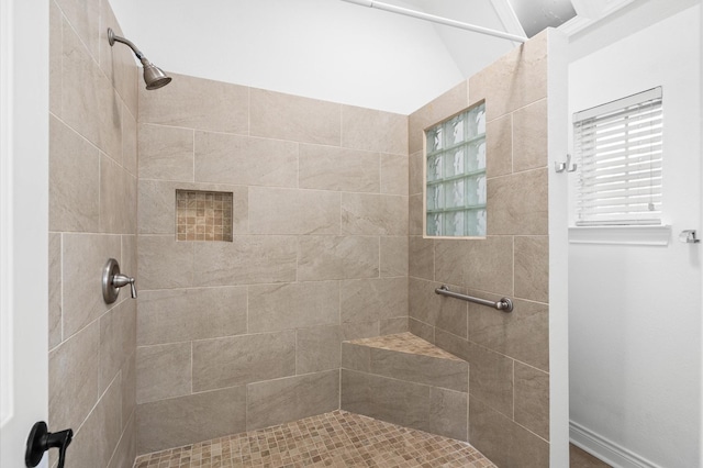 bathroom with tiled shower