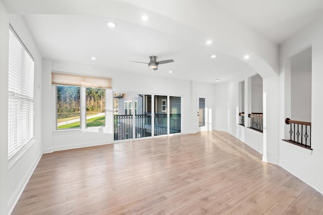 unfurnished room with light wood-type flooring and ceiling fan