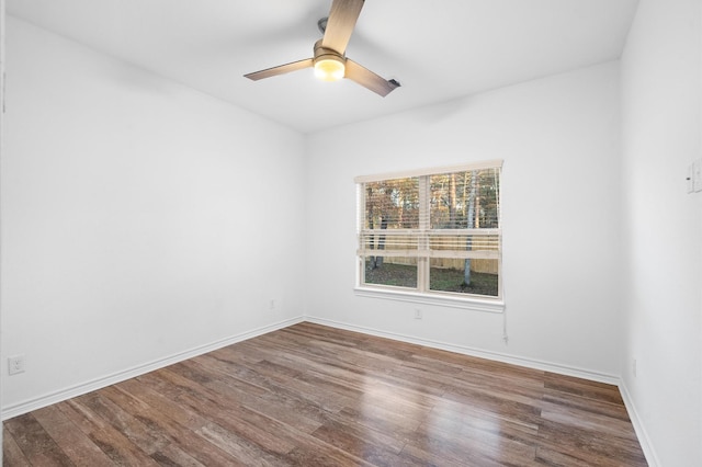 spare room with hardwood / wood-style flooring and ceiling fan