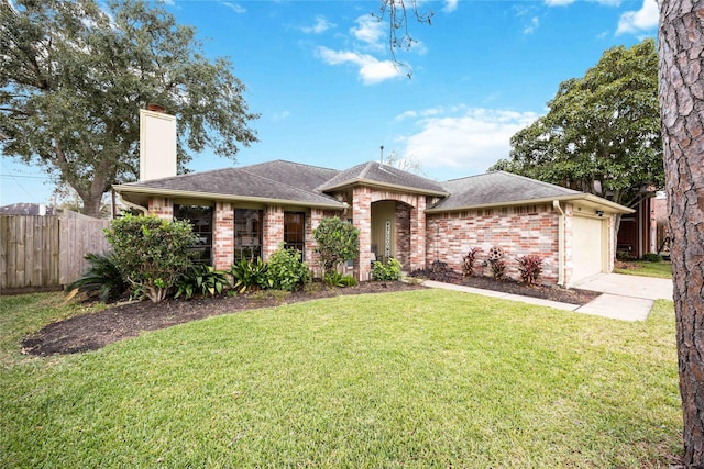 single story home featuring a front yard and a garage