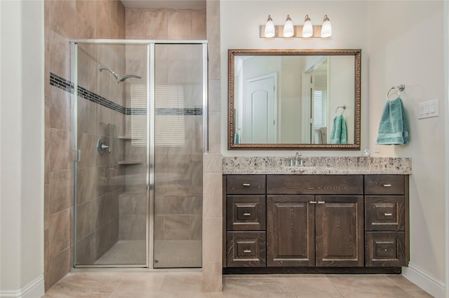 bathroom with vanity, tile patterned floors, and walk in shower