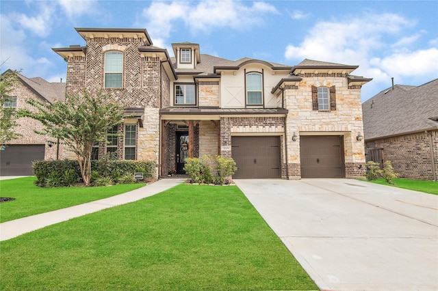 view of front of house featuring a front yard and a garage