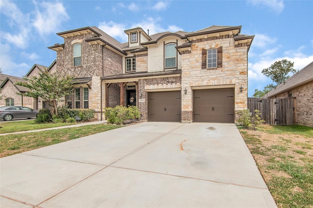 view of front of home featuring a front yard and a garage