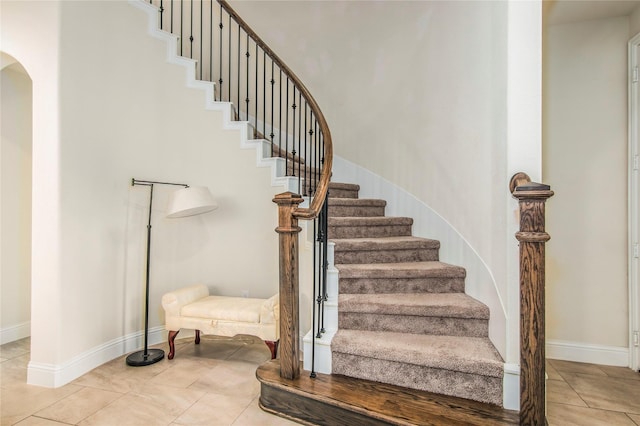 stairs with tile patterned floors