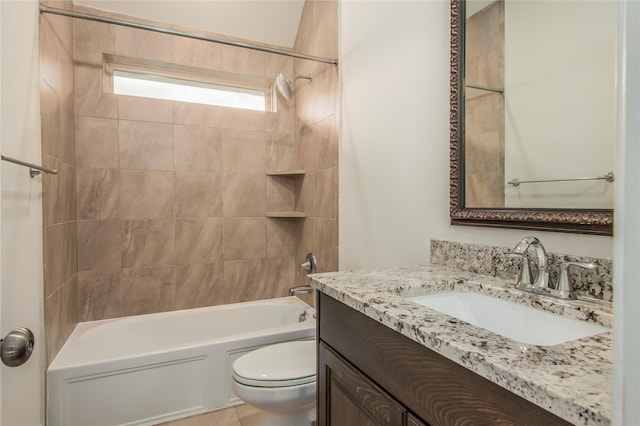 full bathroom featuring vanity, toilet, and tiled shower / bath