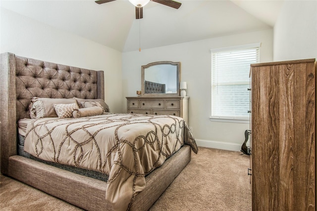 bedroom featuring multiple windows, ceiling fan, light colored carpet, and vaulted ceiling