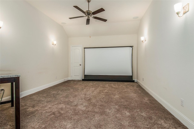 carpeted home theater featuring ceiling fan and lofted ceiling