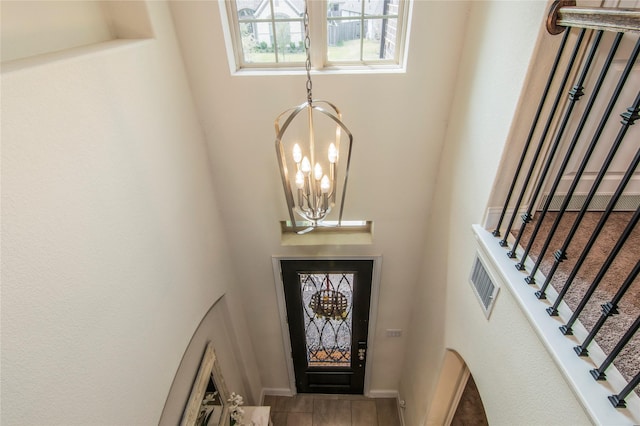 entryway featuring an inviting chandelier