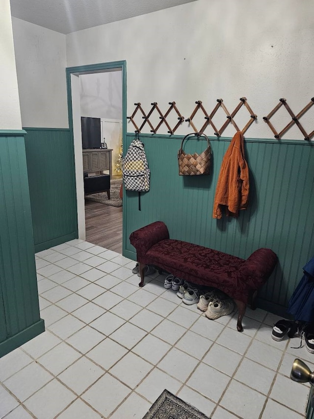 mudroom with light tile patterned floors