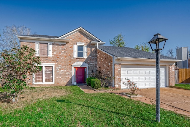 view of property featuring a garage and a front lawn