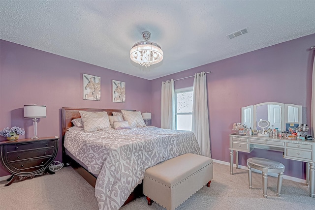 carpeted bedroom with a textured ceiling