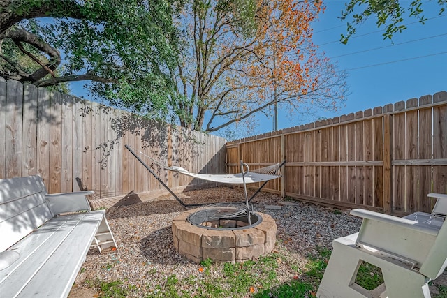 view of yard with an outdoor fire pit