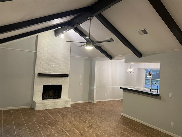 unfurnished living room with vaulted ceiling with beams, a fireplace, and ceiling fan with notable chandelier