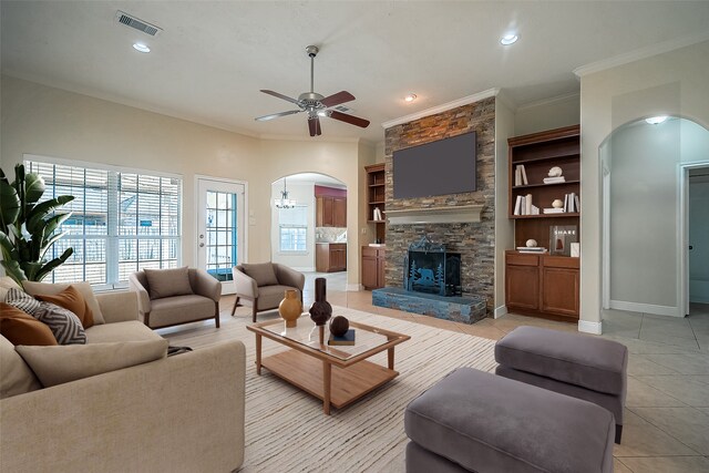 3815 Founders Dr, Needville, TX 77461 - living area featuring arched walkways, crown molding, ceiling fan, light tile patterned floors, and recessed lighting