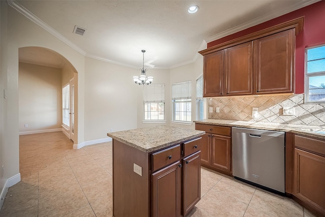 kitchen with decorative backsplash, stainless steel dishwasher, ornamental molding, a kitchen island, and light tile patterned flooring