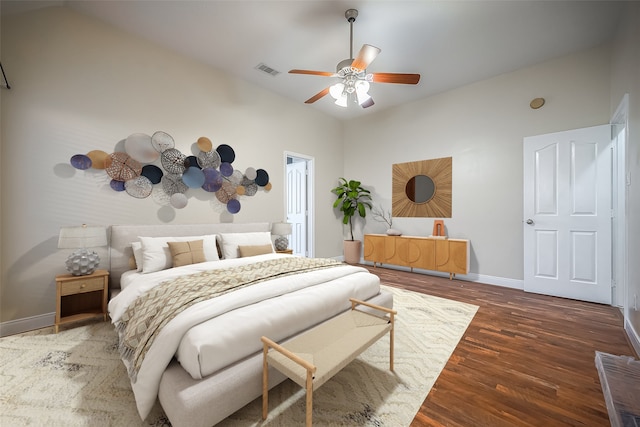 bedroom with ceiling fan and dark hardwood / wood-style flooring