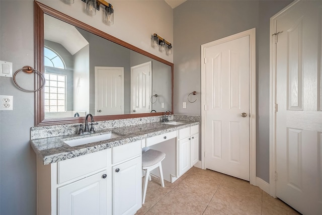3815 Founders Dr, Needville, TX 77461 - full bathroom featuring double vanity, tile patterned flooring, and lofted ceiling