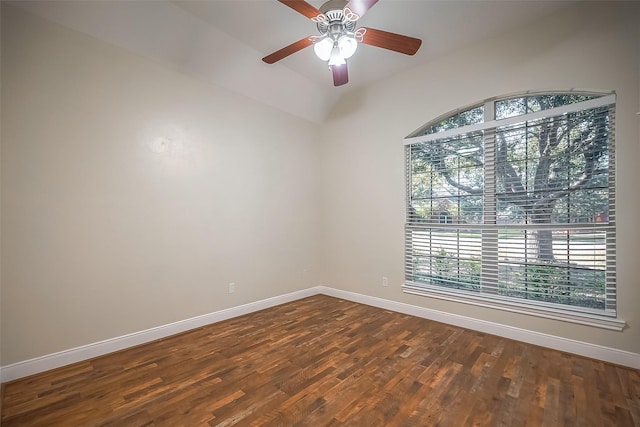 spare room featuring hardwood / wood-style floors, vaulted ceiling, and ceiling fan