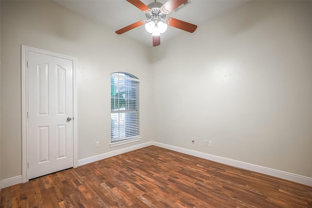 unfurnished room with ceiling fan and dark wood-type flooring