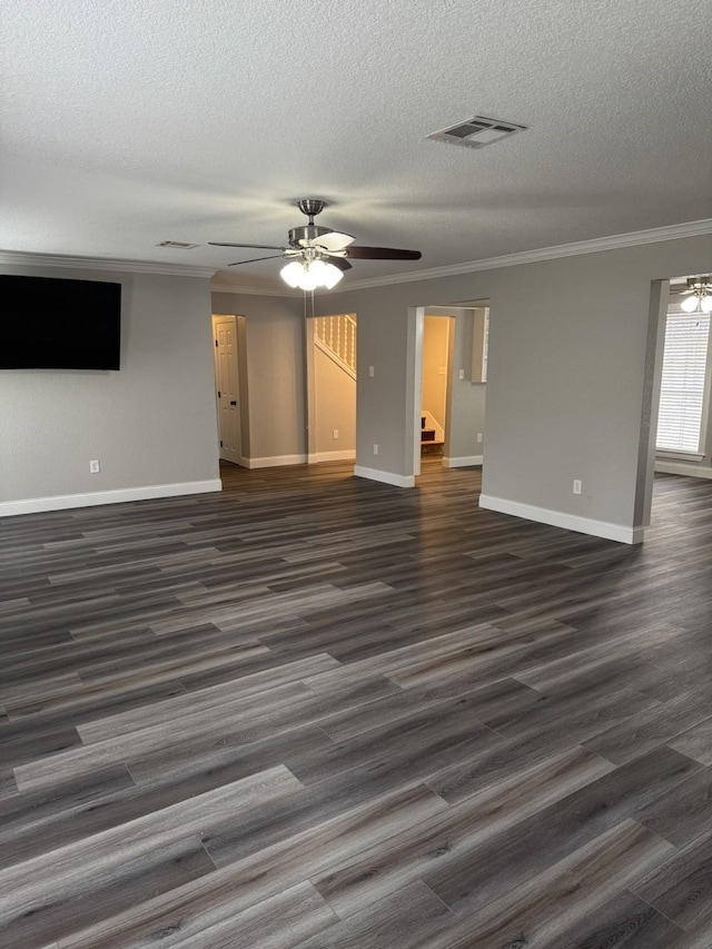 unfurnished living room with crown molding, ceiling fan, dark wood-type flooring, and a textured ceiling