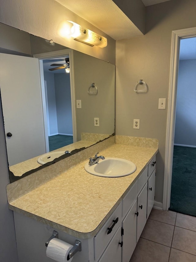 bathroom featuring tile patterned floors, ceiling fan, and vanity