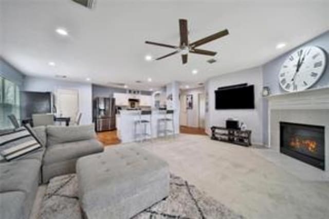 living room featuring ceiling fan