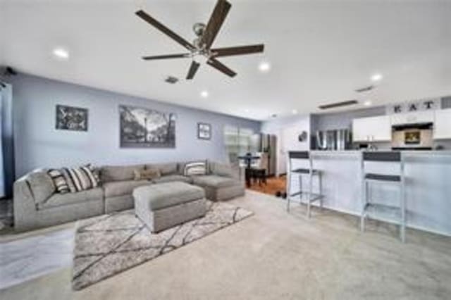 living room with ceiling fan