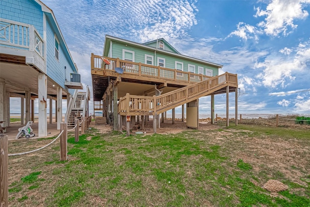 back of house with a wooden deck