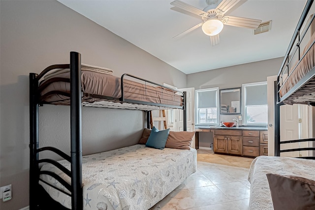 tiled bedroom with ceiling fan