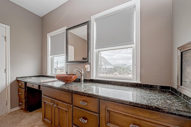 bathroom featuring tile patterned flooring and vanity