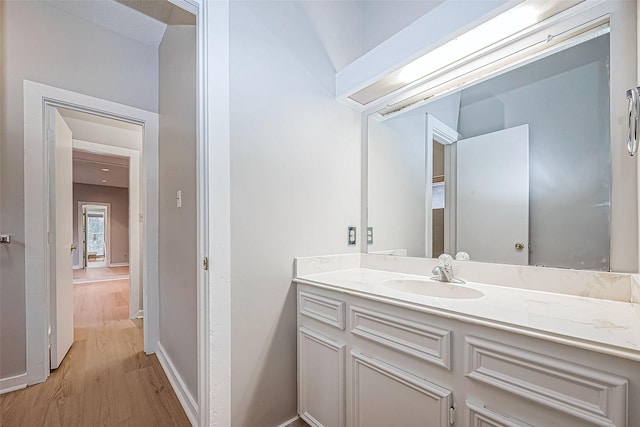 bathroom featuring hardwood / wood-style floors and vanity