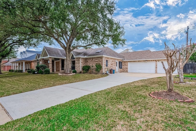 ranch-style home with a garage and a front lawn