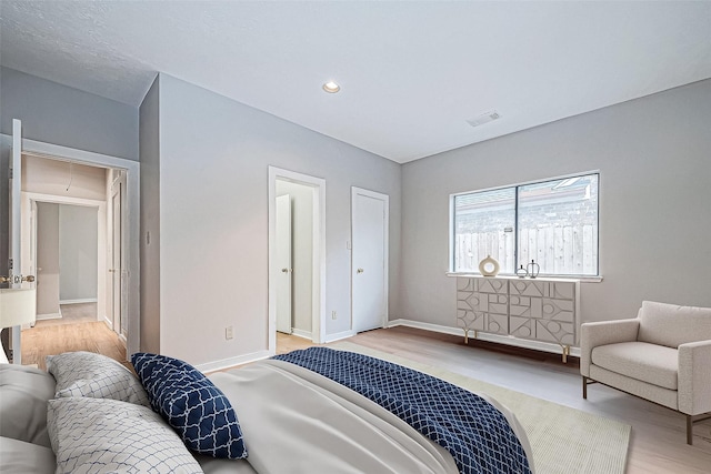 bedroom with light wood-type flooring