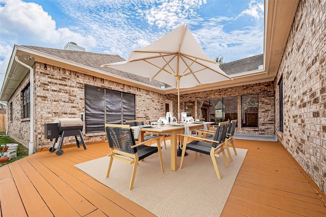 wooden deck with area for grilling