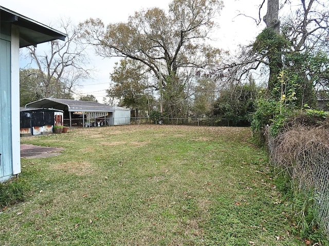 view of yard with a carport