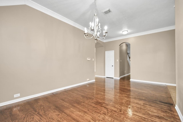 interior space featuring dark hardwood / wood-style flooring, crown molding, and a chandelier