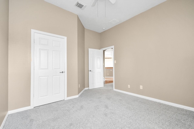 unfurnished bedroom featuring ceiling fan and light carpet