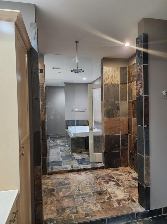 bathroom featuring shower with separate bathtub