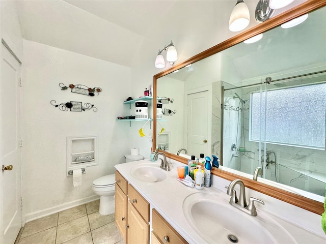 bathroom with tile patterned floors, vanity, toilet, and an enclosed shower