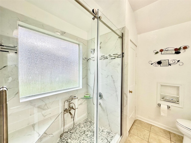 bathroom with toilet, tile patterned floors, and an enclosed shower