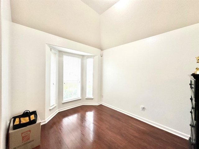 spare room with dark hardwood / wood-style floors