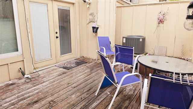 wooden terrace with french doors and cooling unit