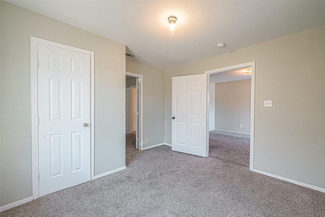 unfurnished bedroom with carpet flooring