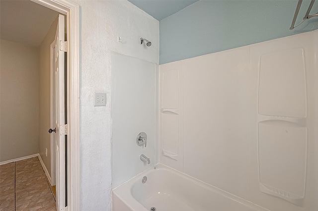 bathroom featuring tile patterned flooring and shower / bathtub combination