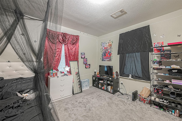 carpeted bedroom with a textured ceiling