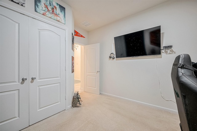 carpeted bedroom featuring a closet